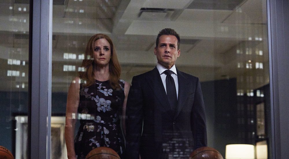 SUITS -- "P.S.L." Episode 610 -- Pictured: (l-r) Sarah Rafferty as Donna Paulsen, Gabriel Macht as Harvey Specter -- (Photo by: Shane Mahood/USA Network)