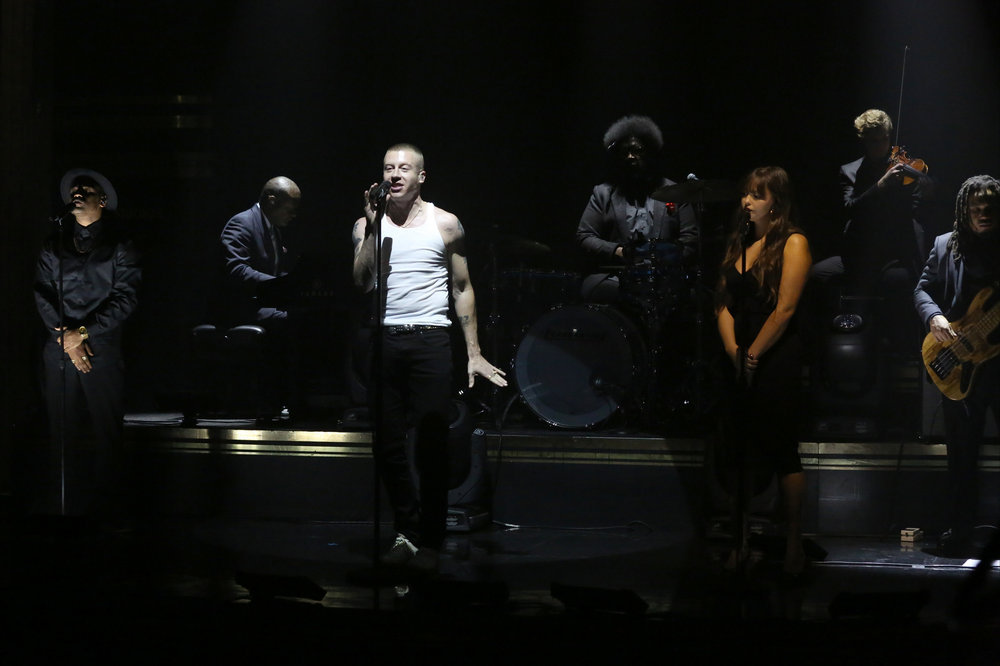 THE TONIGHT SHOW STARRING JIMMY FALLON -- Episode 0572 -- Pictured: (l-r) Musical guest Macklemore performs with Ariana Deboo and The Roots on November 16, 2016 -- (Photo by: Andrew Lipovsky/NBC)