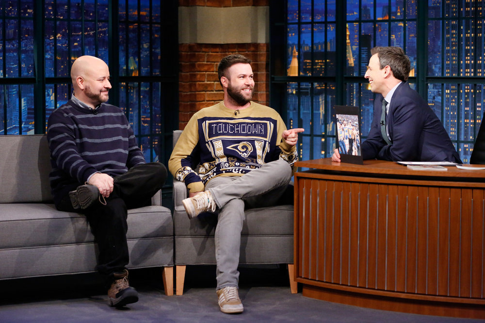 LATE NIGHT WITH SETH MEYERS -- Episode 464 -- Pictured: (l-r) Writers Marc Andreyko, Taran Killam during an interview with host Seth Meyers on December 19, 2016 -- (Photo by: Lloyd Bishop/NBC)