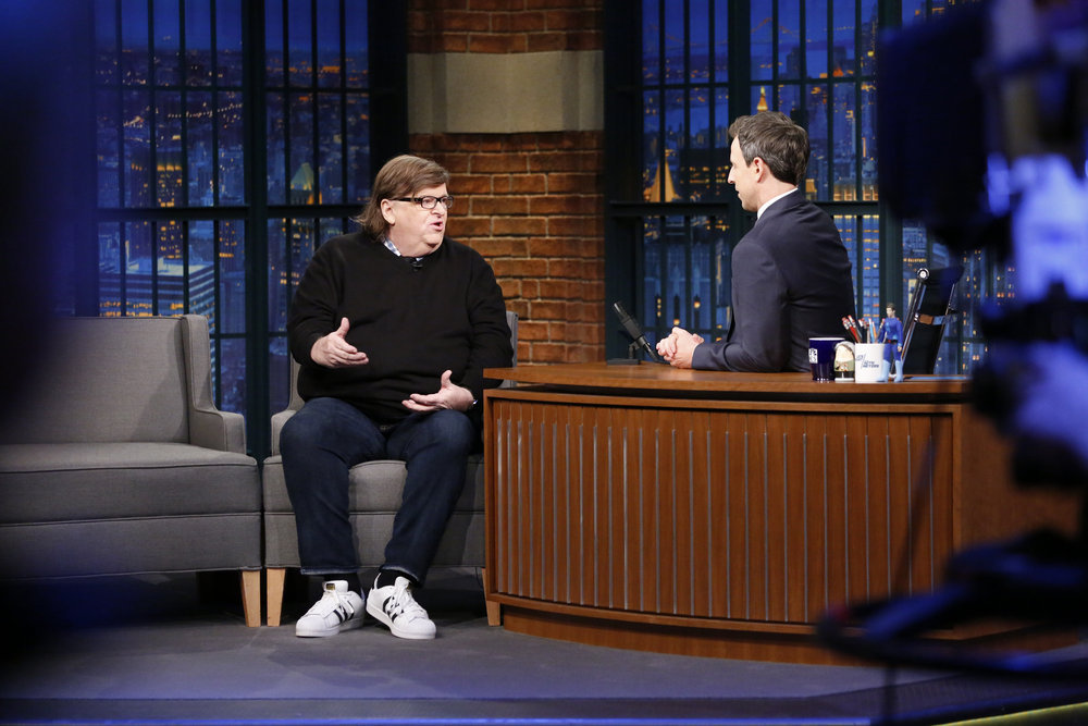 LATE NIGHT WITH SETH MEYERS -- Episode 458 -- Pictured: (l-r) Filmmaker Michael Moore during an interview with host Seth Meyers on December 7, 2016 -- (Photo by: Lloyd Bishop/NBC)
