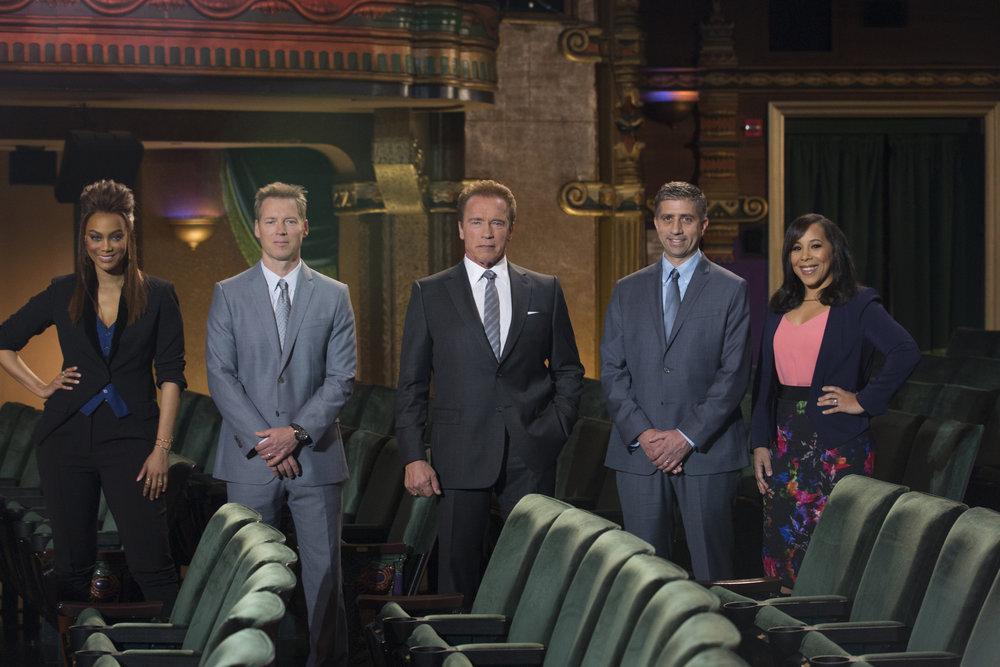 THE NEW CELEBRITY APPRENTICE -- "In Here You Call Me Governor" Episode 1502 -- Pictured: (l-r) Tyra Banks, Patrick Knapp Schwarzenegger, Arnold Schwarzenegger, Trident Executives John Ghingo, Katie Williams -- (Photo by: Luis Trinh/NBC)
