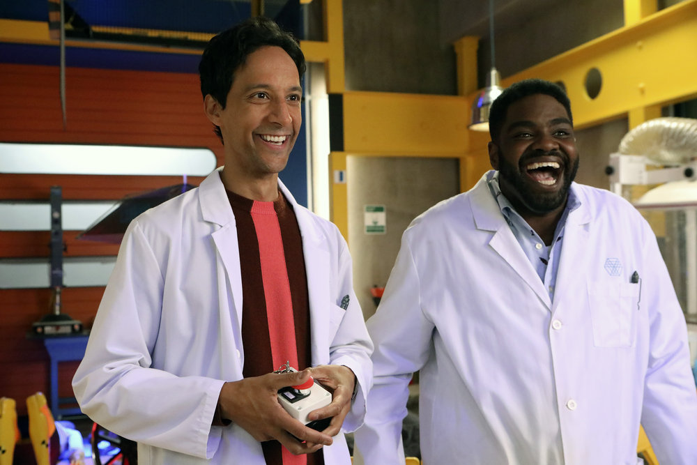 POWERLESS -- "Wayne Dream Team" Episode 103 -- Pictured: (l-r) Danny Pudi as Teddy, Ron Funches as Ron -- (Photo by: Evans Vestal Ward/Warner Bros/NBC)