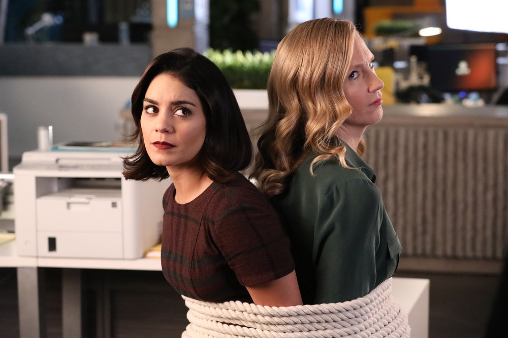 POWERLESS -- "Emily Dates A Henchman" Episode 107 -- Pictured: (l-r) Vanessa Hudgens as Emily, Christina Kirk as Jackie -- (Photo by: Evans Vestal Ward/NBC)