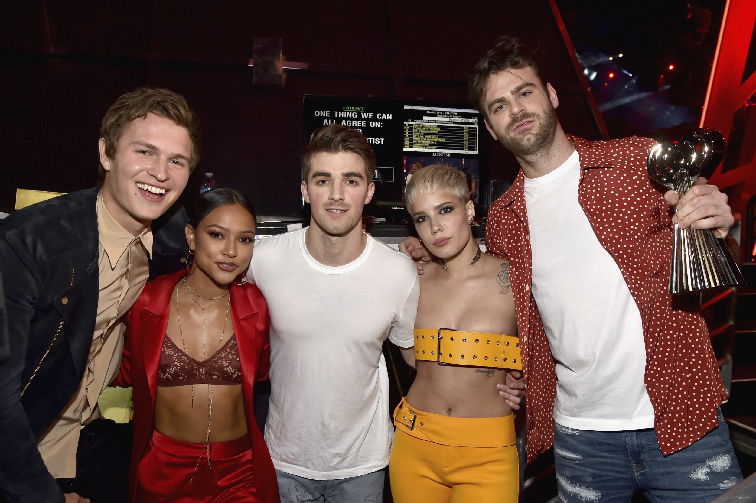 INGLEWOOD, CA - MARCH 05: Actor Ansel Elgort (L) and model Karrueche Tran (2nd L) poses backstage with DJs Drew Taggart (C) and Alex Pall (R) of The Chainsmokers and singer Halsey (2nd R), winners of Dance Song of the Year for 'Closer,' at the 2017 iHeartRadio Music Awards which broadcast live on Turner's TBS, TNT, and truTV at The Forum on March 5, 2017 in Inglewood, California. (Photo by Frazer Harrison/Getty Images for iHeartMedia) *** Local Caption *** Ansel Elgort; Drew Taggart; Alex Pall; Halsey; Karrueche Tran