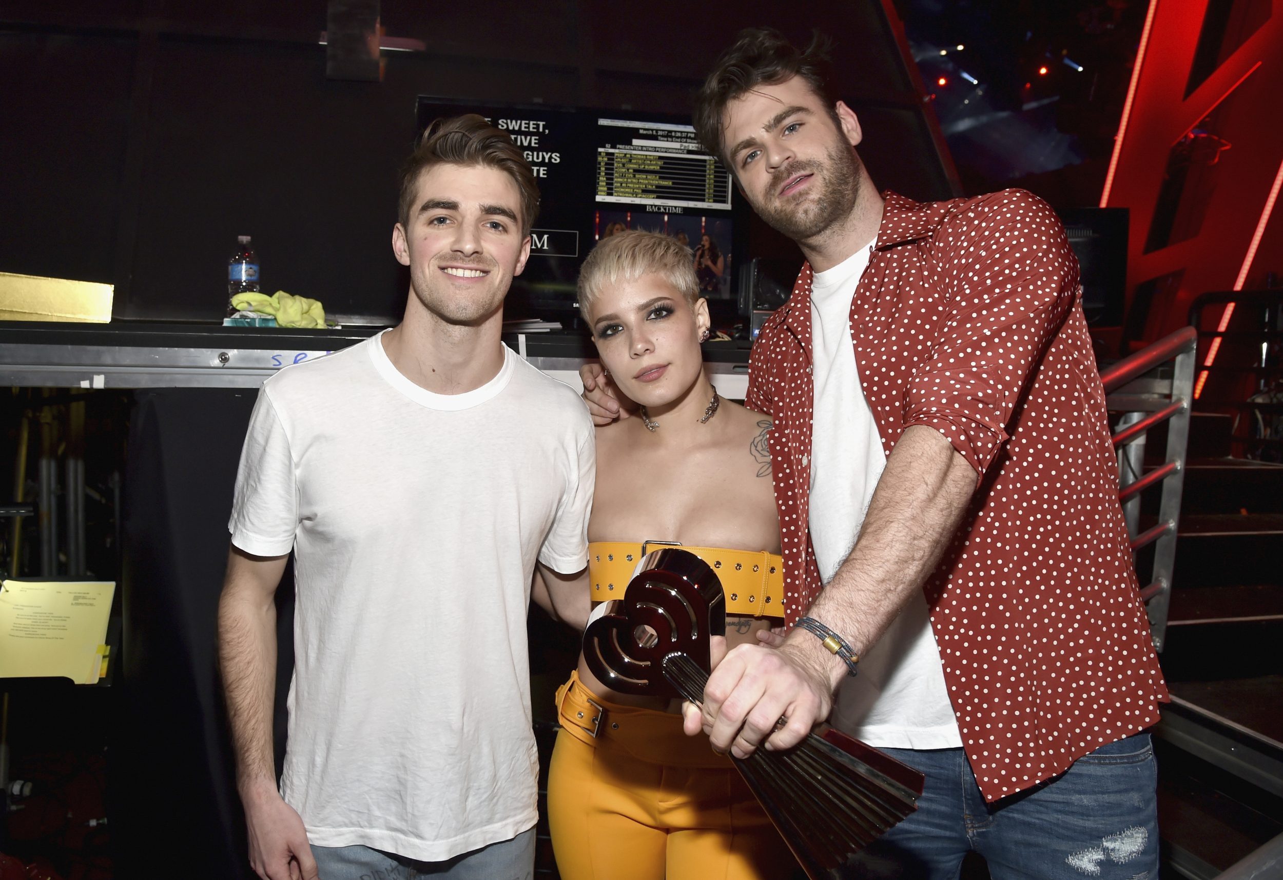 INGLEWOOD, CA - MARCH 05: DJs Drew Taggart (2nd L) and Alex Pall (R) of The Chainsmokers and singer Halsey (C), winners of Dance Song of the Year for 'Closer,' at the 2017 iHeartRadio Music Awards which broadcast live on Turner's TBS, TNT, and truTV at The Forum on March 5, 2017 in Inglewood, California. (Photo by Frazer Harrison/Getty Images for iHeartMedia) *** Local Caption *** Drew Taggart; Alex Pall; Halsey