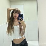 Lisa from BLACKPINK in a mirror selfie